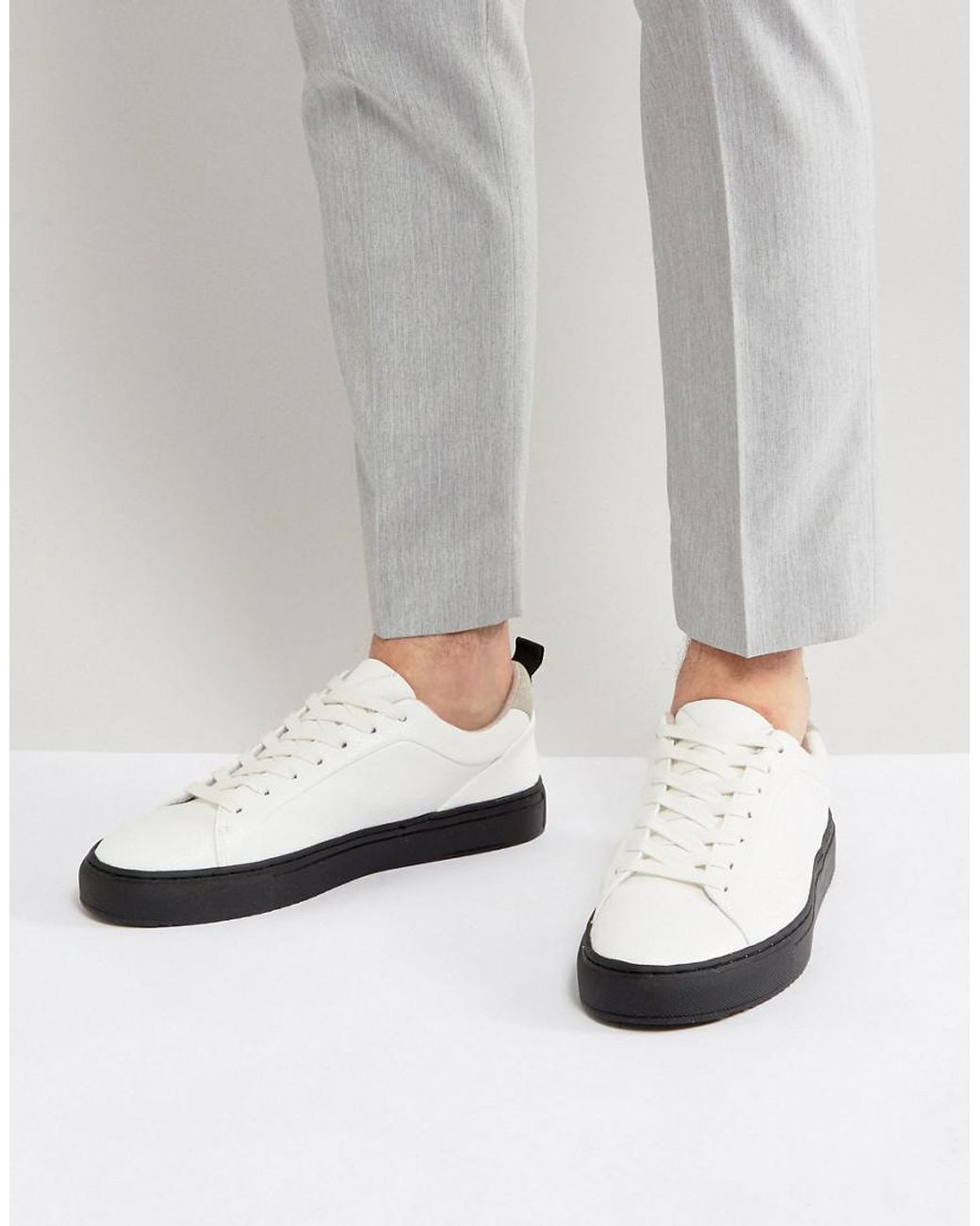 Black with white sole trainers hot sale