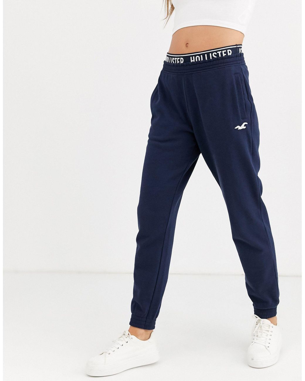 Hollister large iconic logo cuffed jogger in navy, ASOS