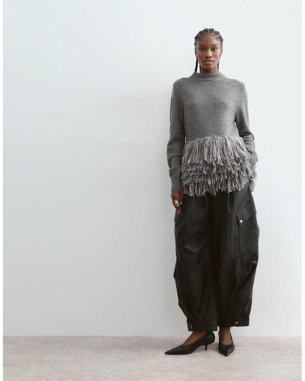 ARRANGE Gray Knitted Sweater With Fringe Hem