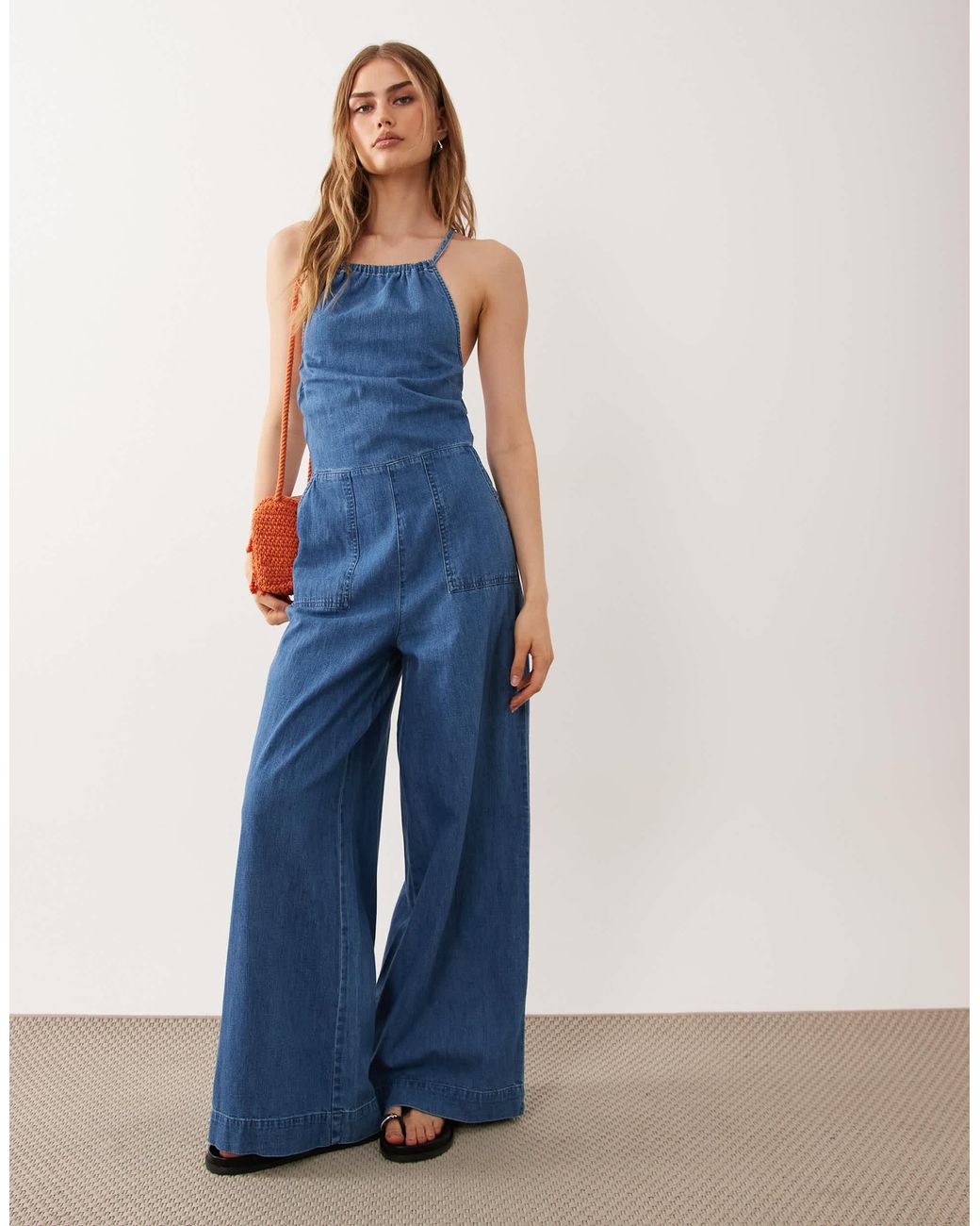 ASOS Blue Halter Neck Denim Jumpsuit With Patch Pockets