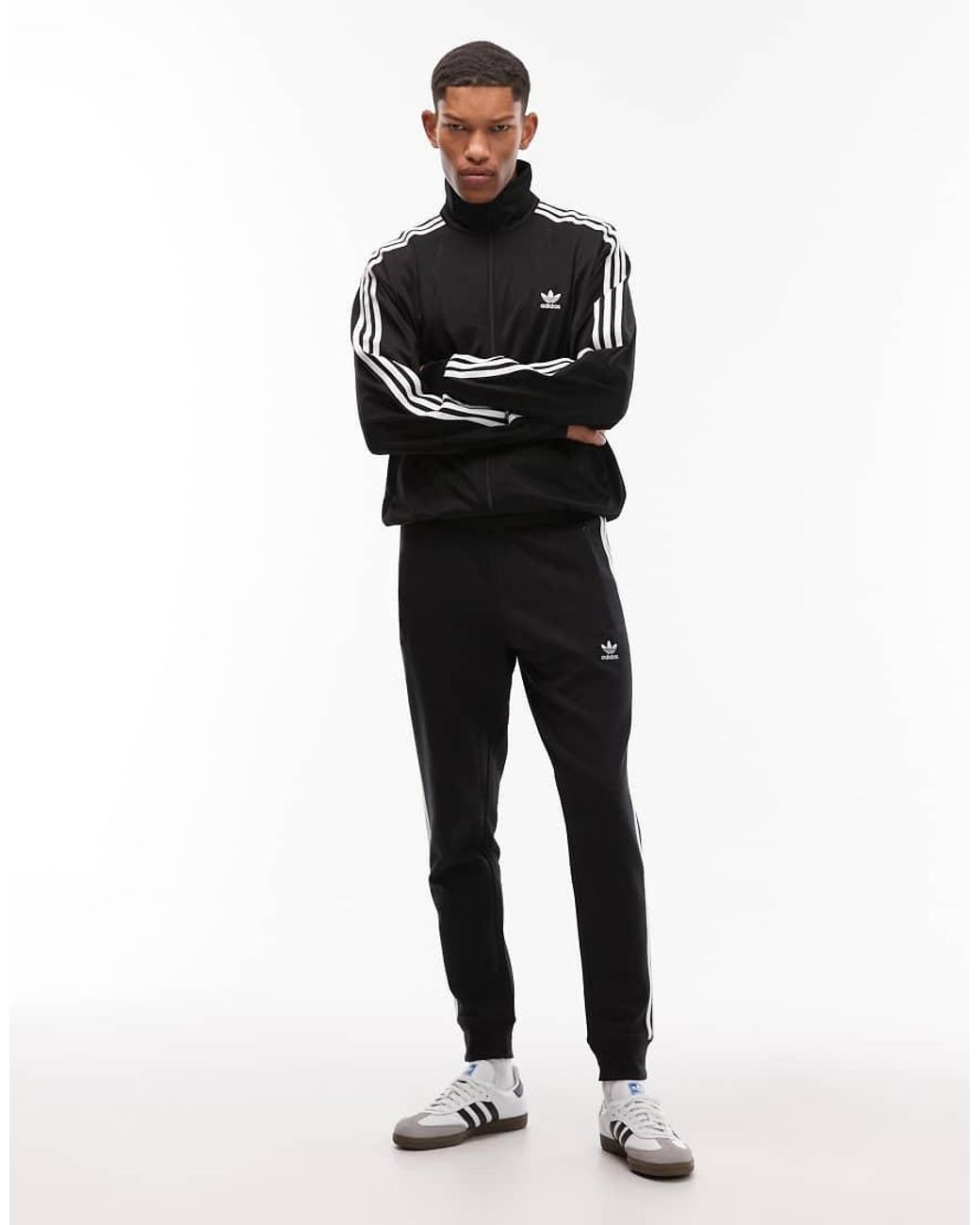 Adidas Originals Blue Three Stripe joggers for men