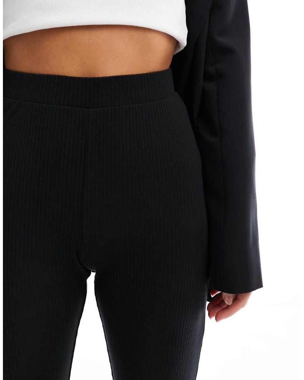 ASOS Black Asos Design Petite Rib Flare Trouser With Lettuce Hem
