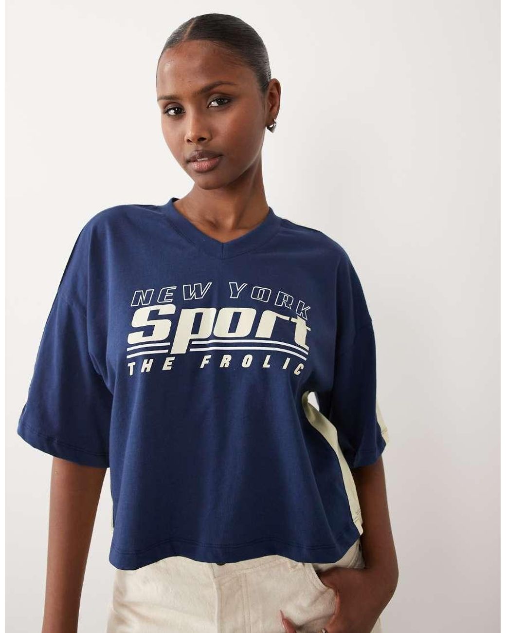 The Frolic Blue Exclusive V-neck Graphic Front Contrast Yellow Trim Cropped Football Jersey
