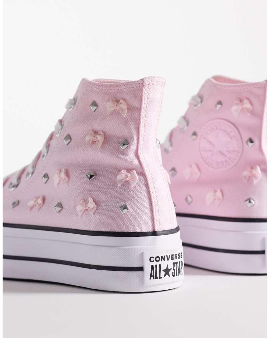 Converse Pink Chuck Taylor All Star Lift Hi Platform Sneakers With Bow And Stud Detailing