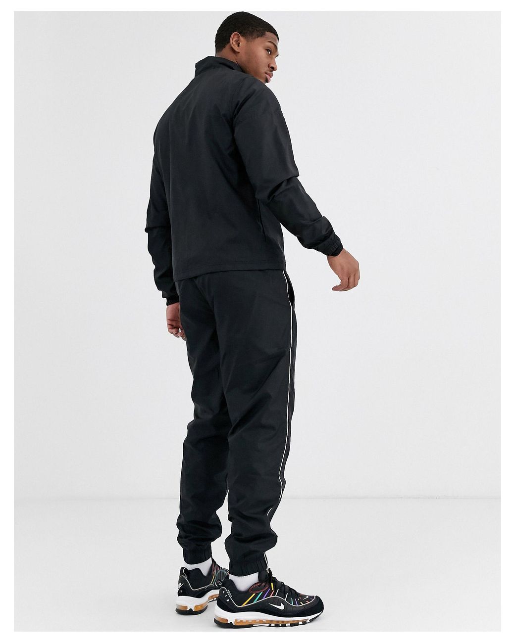 nike woven tracksuit set in black