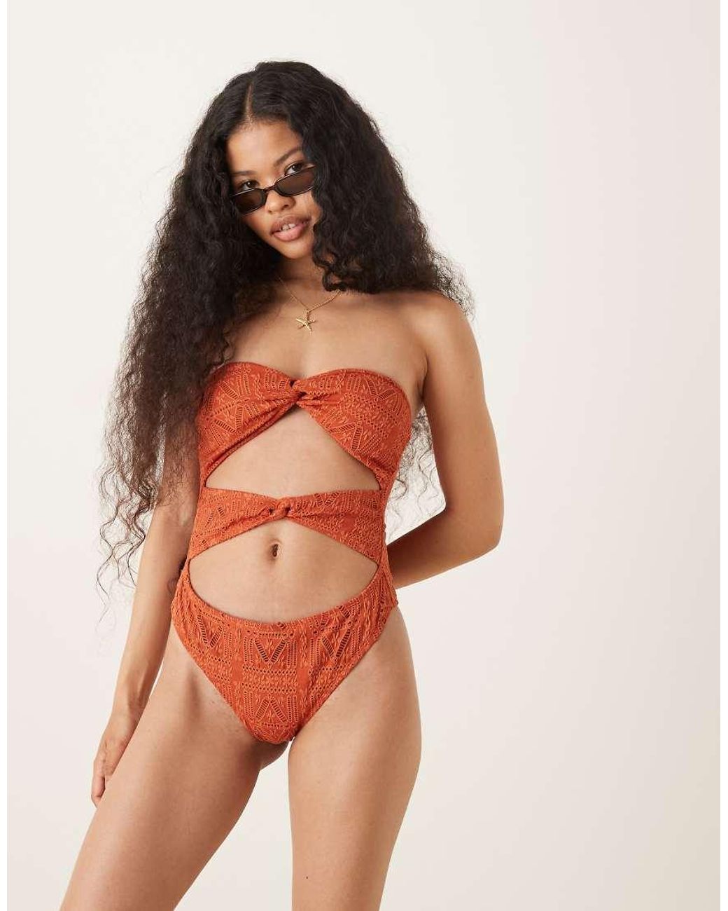 ASOS Orange Asos Design Petite Kyle Eyelet Brooke Twist Front Strapless Swimsuit
