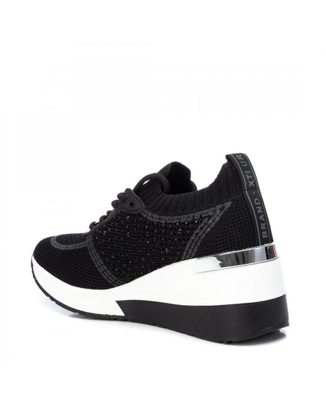 xti black wedge trainers