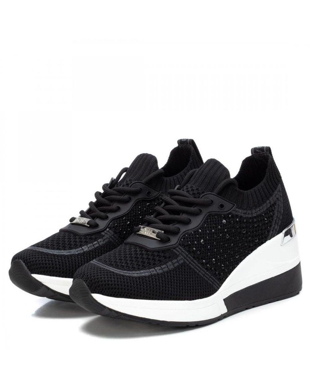 xti black wedge trainers