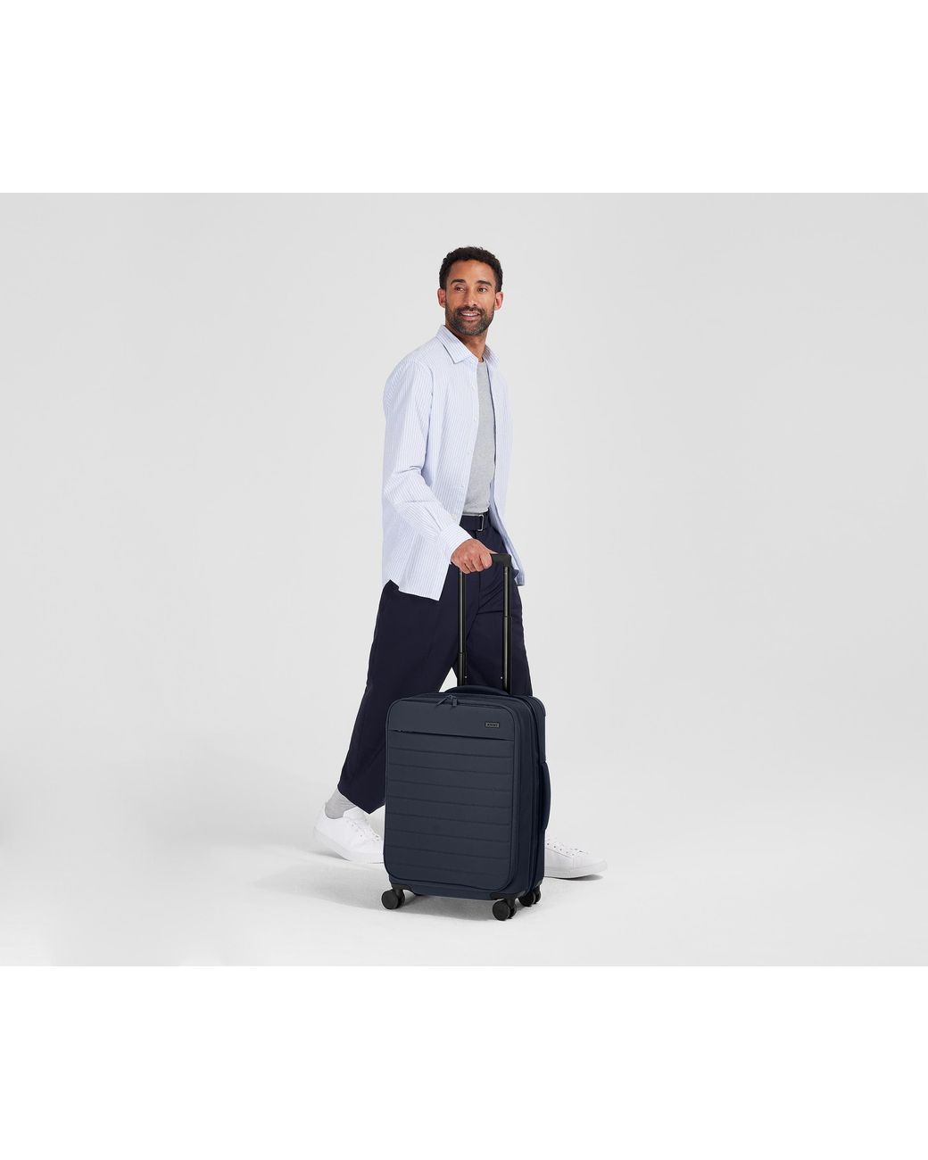 Away Travel Blue Softside Bigger Carry-On