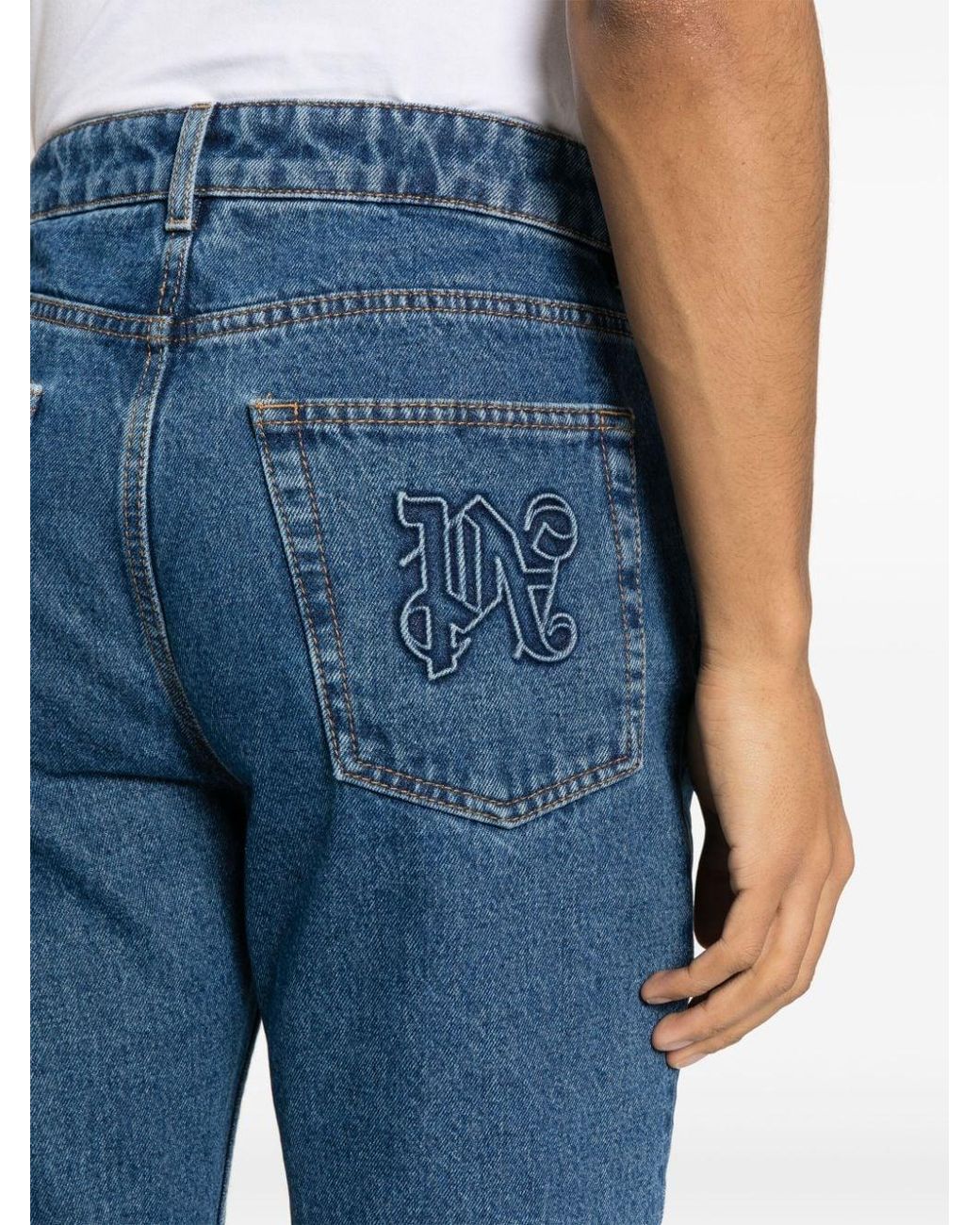 Palm Angels Blue Jeans With Monogram Embroidery for men