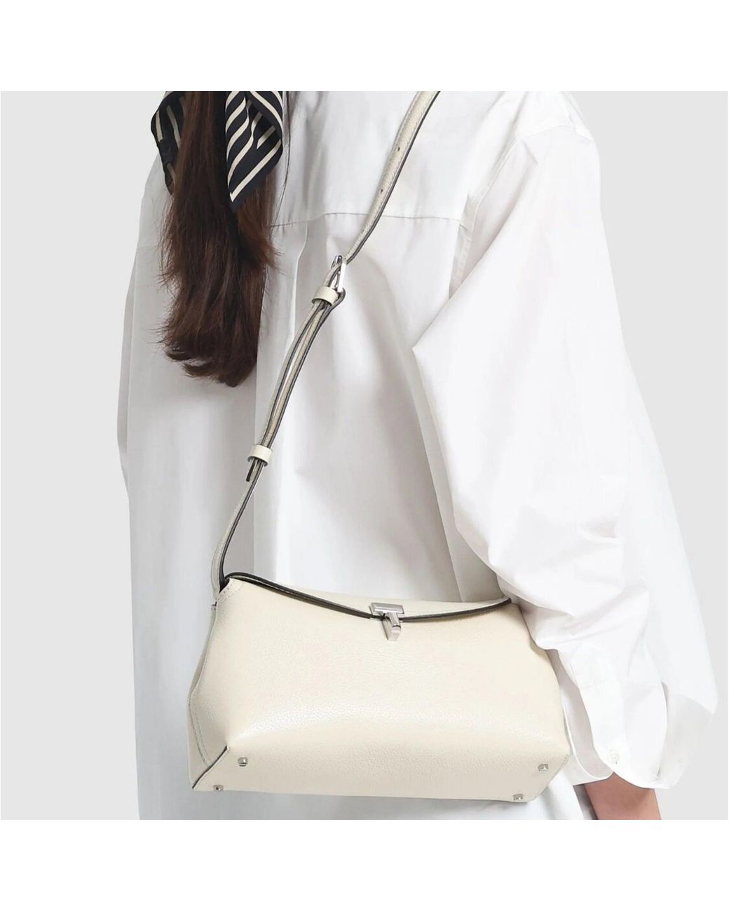 Totême Natural T-Lock Leather Clutch Bag