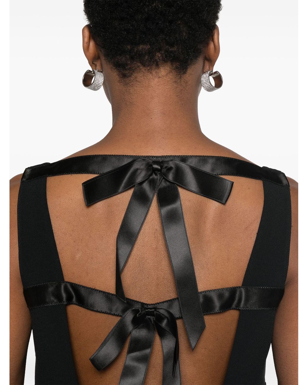 Minivestido con logo triangular de Prada de color Black