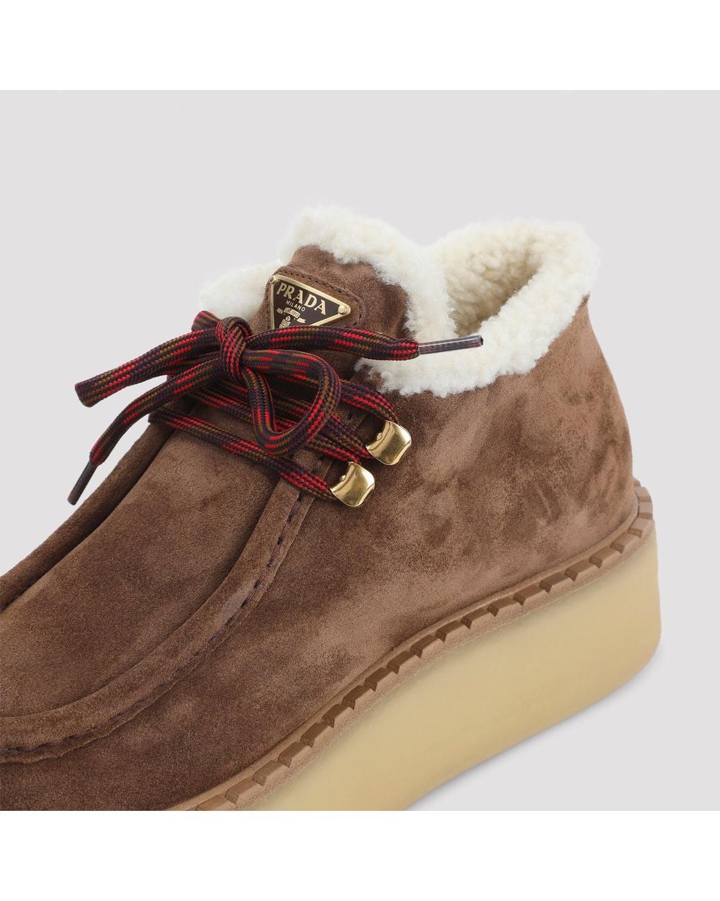 Bottines à lacets Prada en coloris Brown