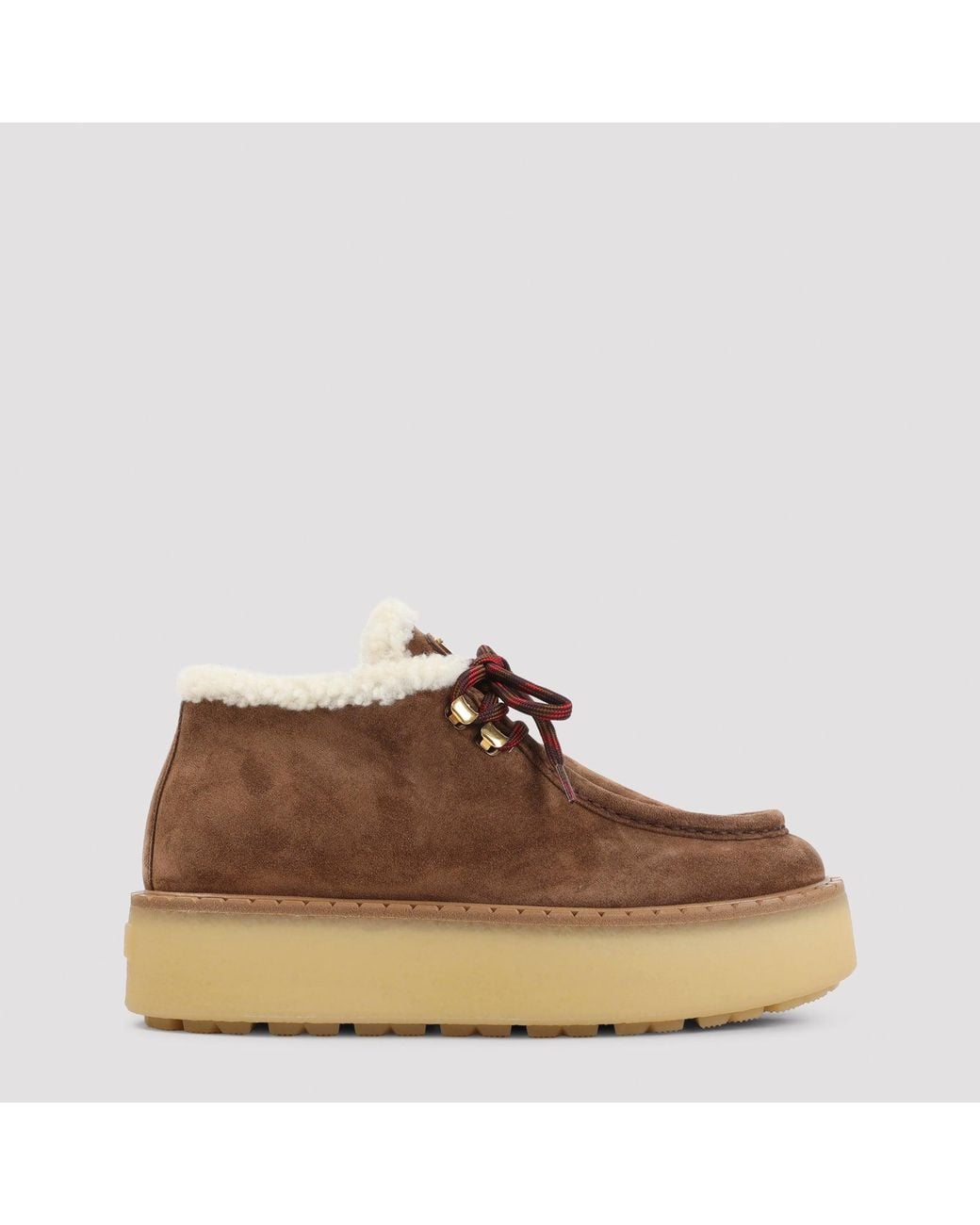 Bottines à lacets Prada en coloris Brown