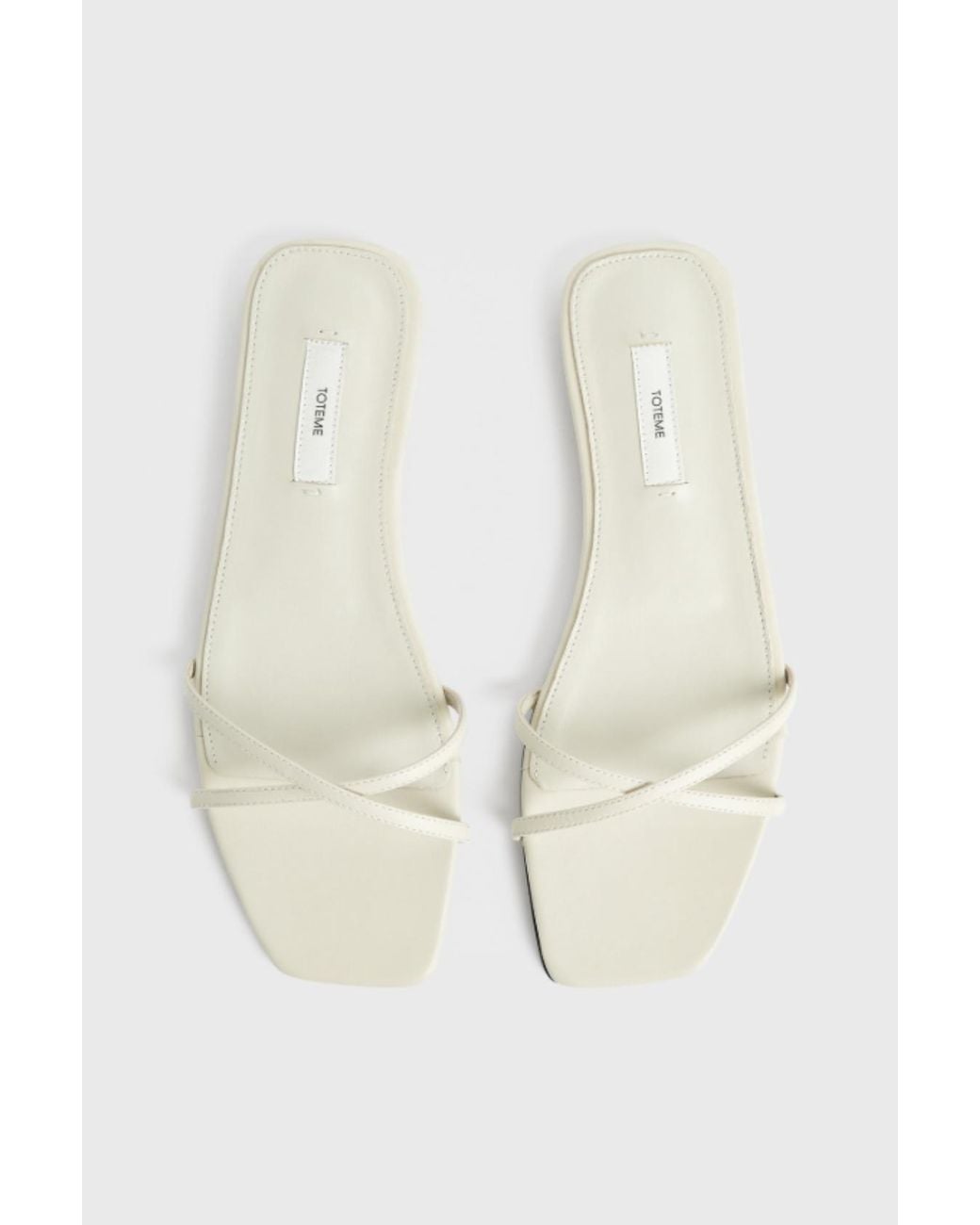 Totême White Leather Crossover Slides Off