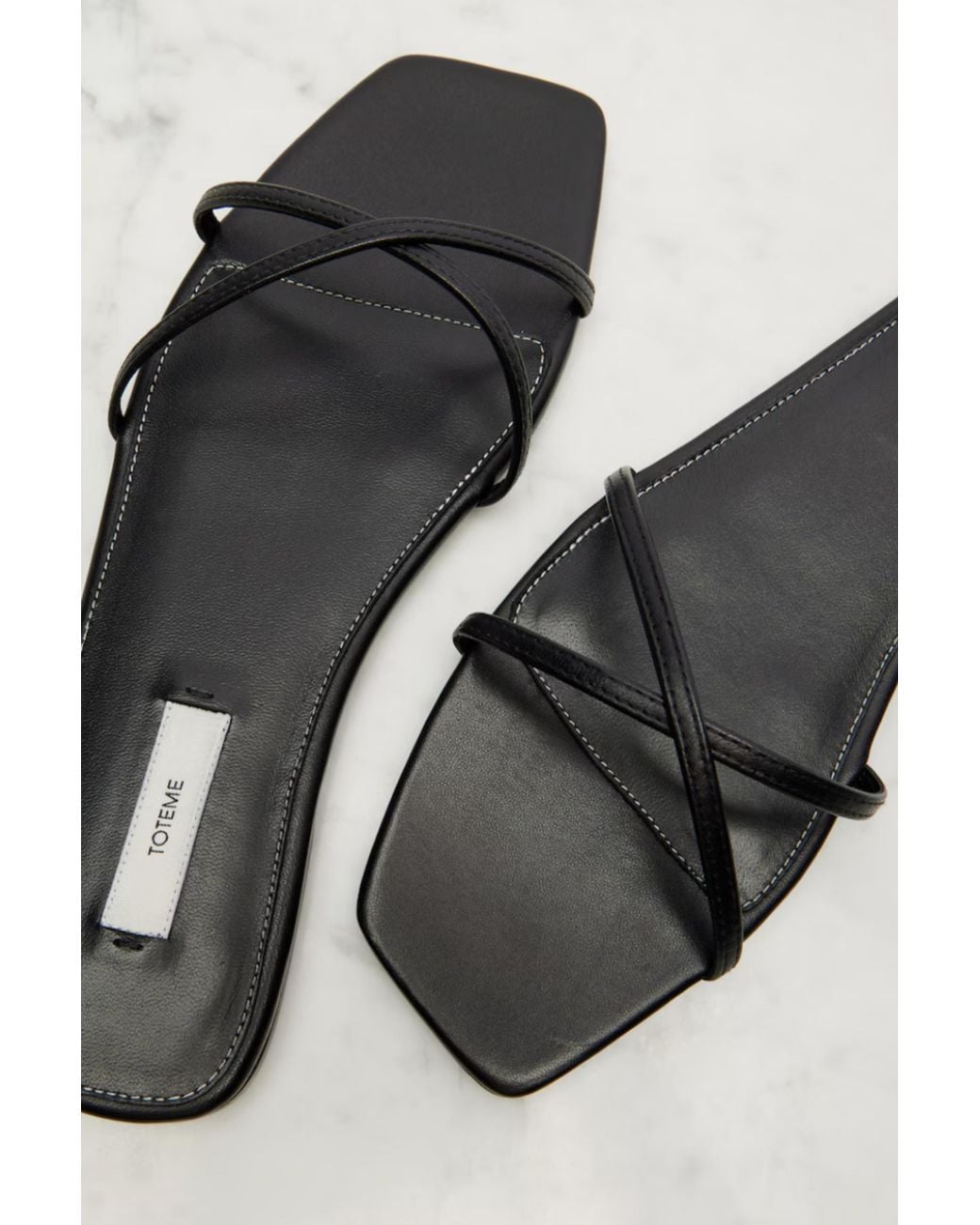 Totême Black Leather Crossover Slides