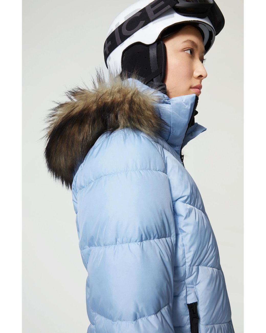 light blue ski outfit