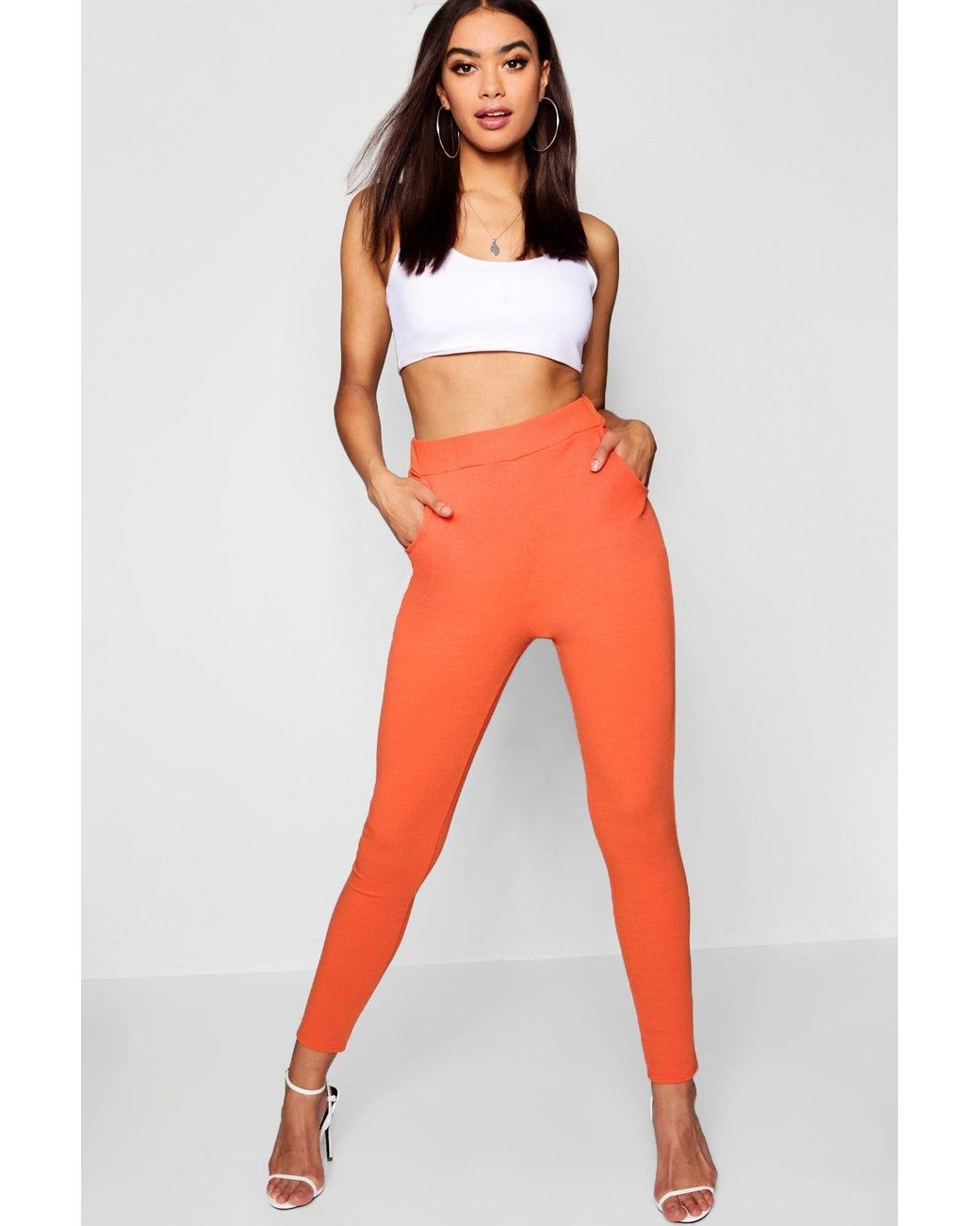 orange skinny trousers