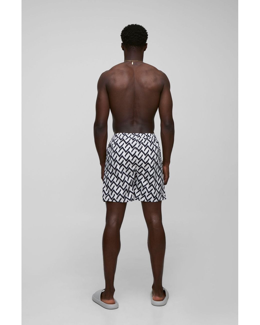 BoohooMAN Black Abstract Pattern Printed Mid Length Swim Trunks for men