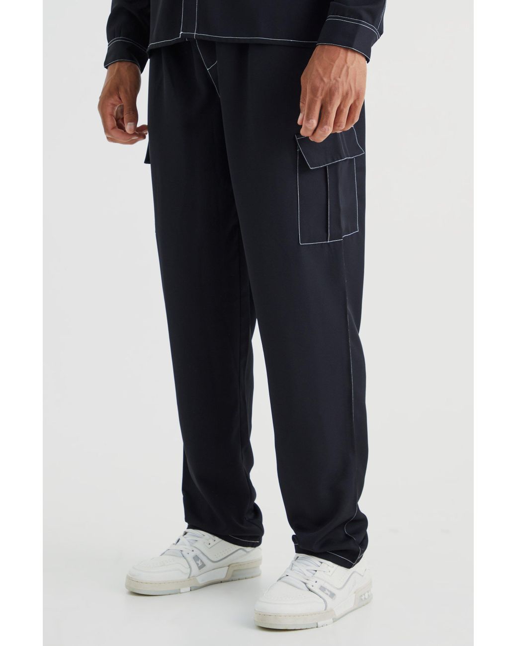 ASOS DESIGN seam detail cargo pants in black with contrast stitch