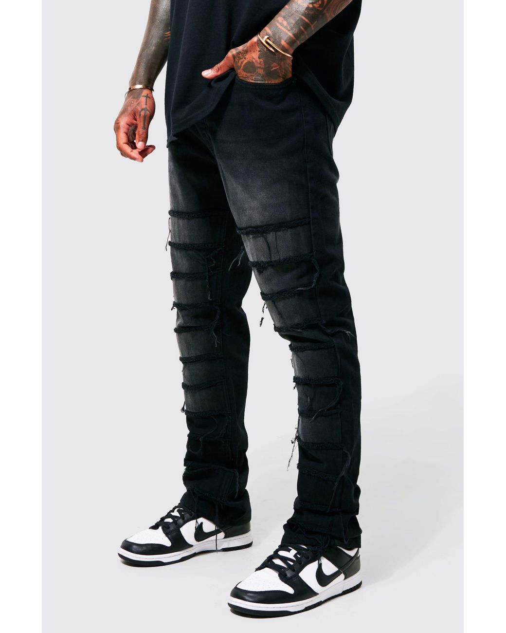 BoohooMAN Denim Stacked Flare Diagonal Distressed Jeans in Black for Men |  Lyst