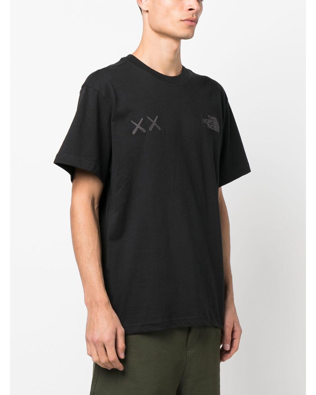 The North Face X Kaws Logo Print Cotton T-shirt in Black for The North Face X Kaws Logo Print Cotton T-shirt in Black for