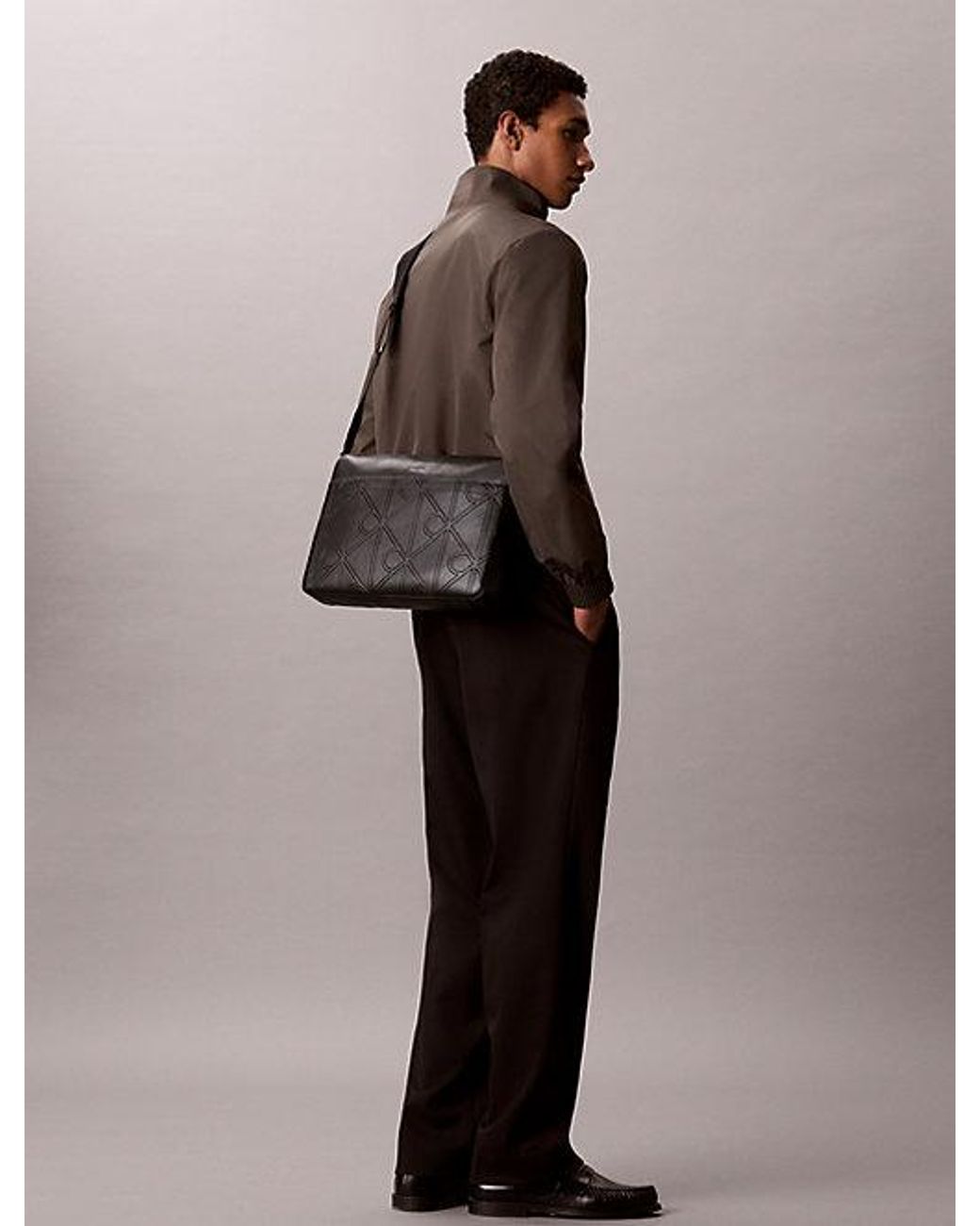 Calvin Klein Black Embossed Emblem Logo Laptop Bag for men