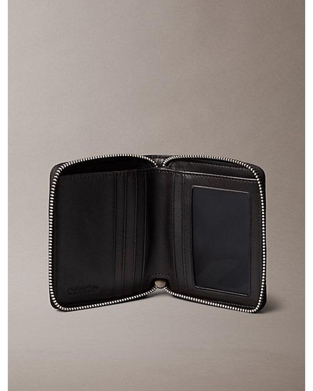 Calvin Klein Black Embossed Woven Zip Billfold Wallet for men