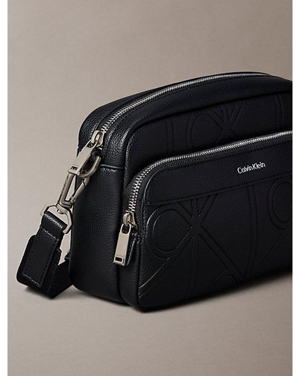 Calvin Klein Black Embossed Emblem Crossbody Camera Bag for men