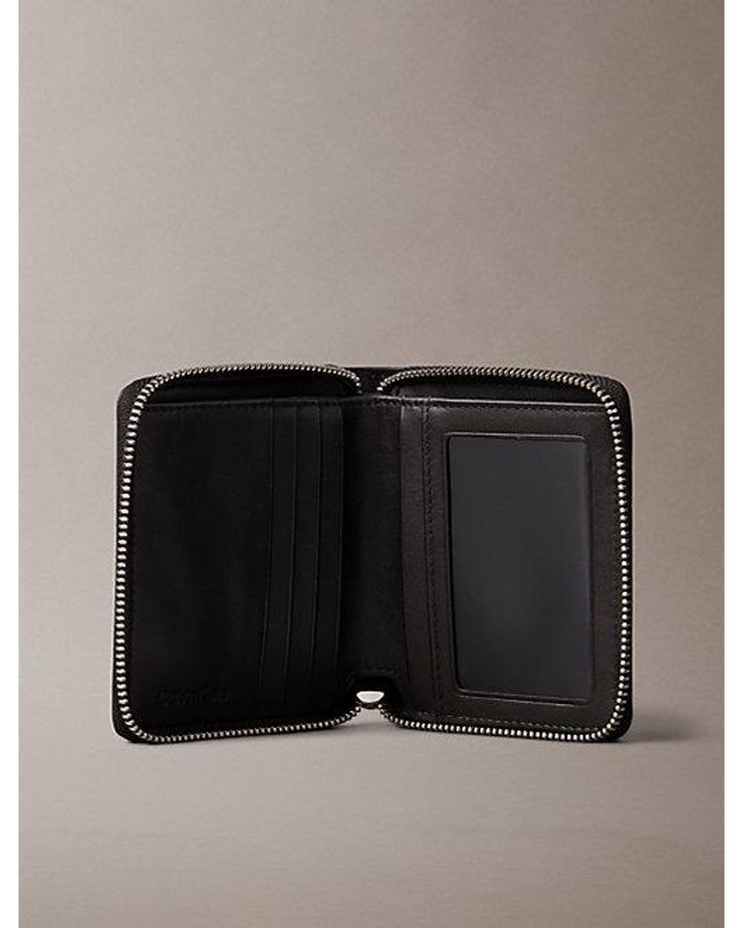 Calvin Klein Black Embossed Allover Monogram Zip Bifold Wallet for men