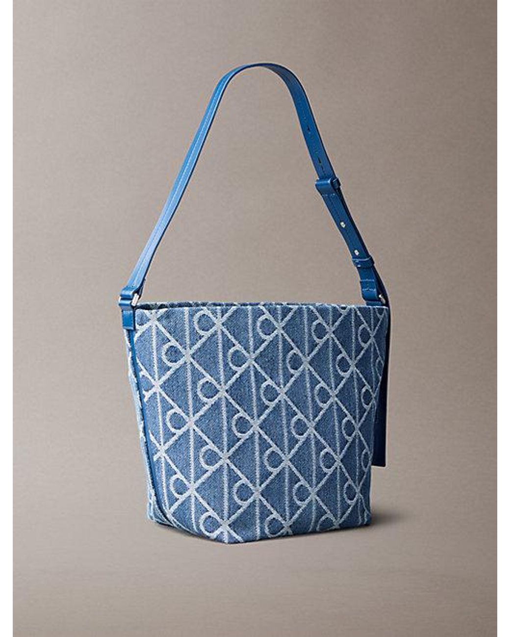Calvin Klein Blue Denim Allover Emblem Logo Bucket Bag