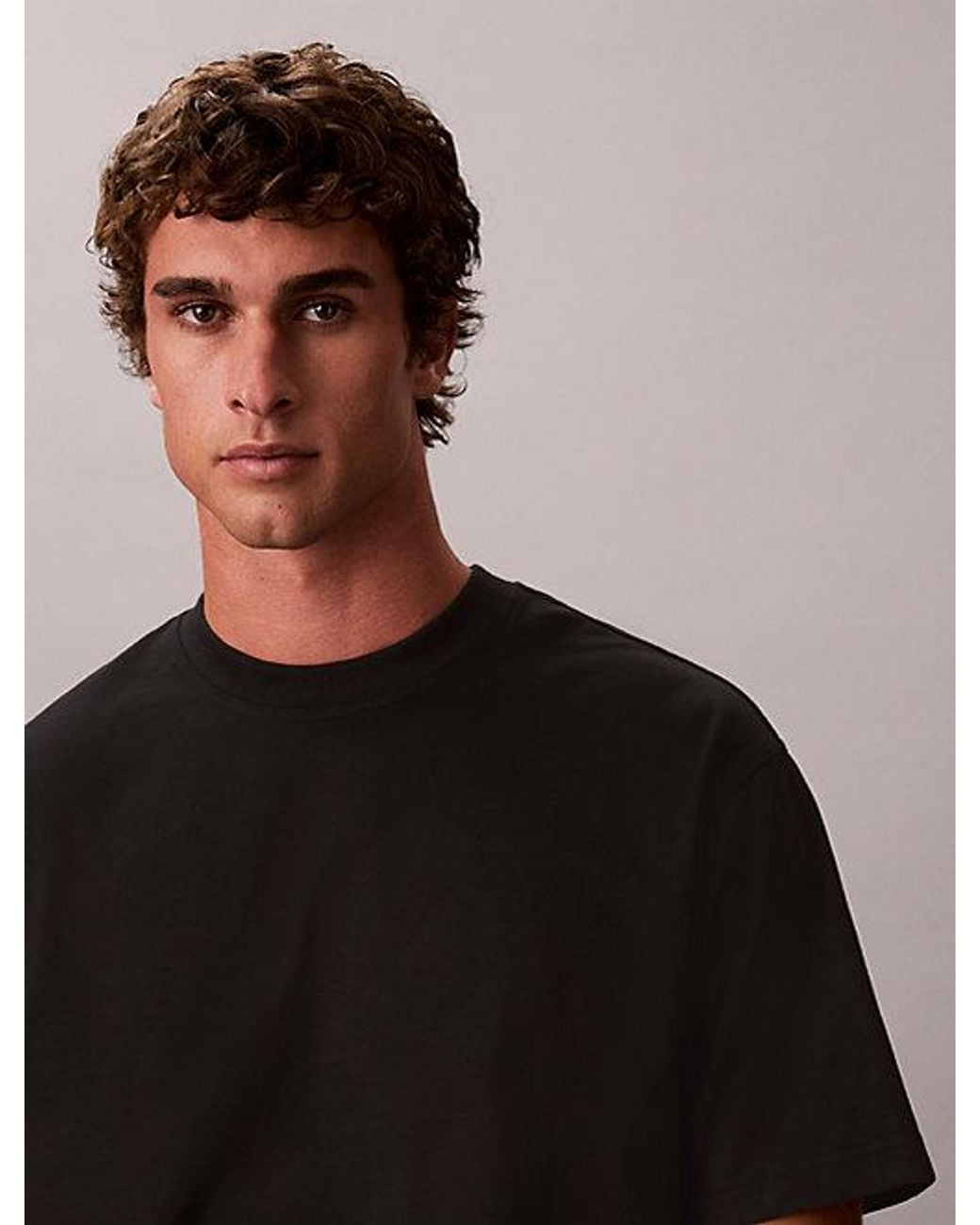 Calvin Klein Black Jeans Relaxed Stencil Logo Graphic Tee for men