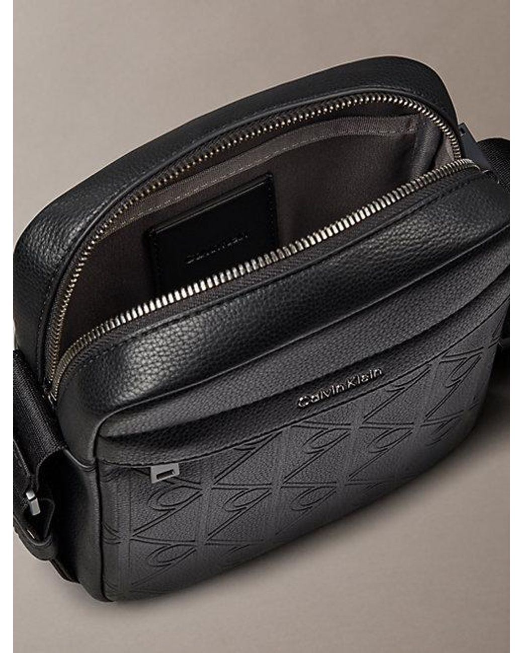 Calvin Klein Black Embossed Emblem Logo Reporter Bag for men