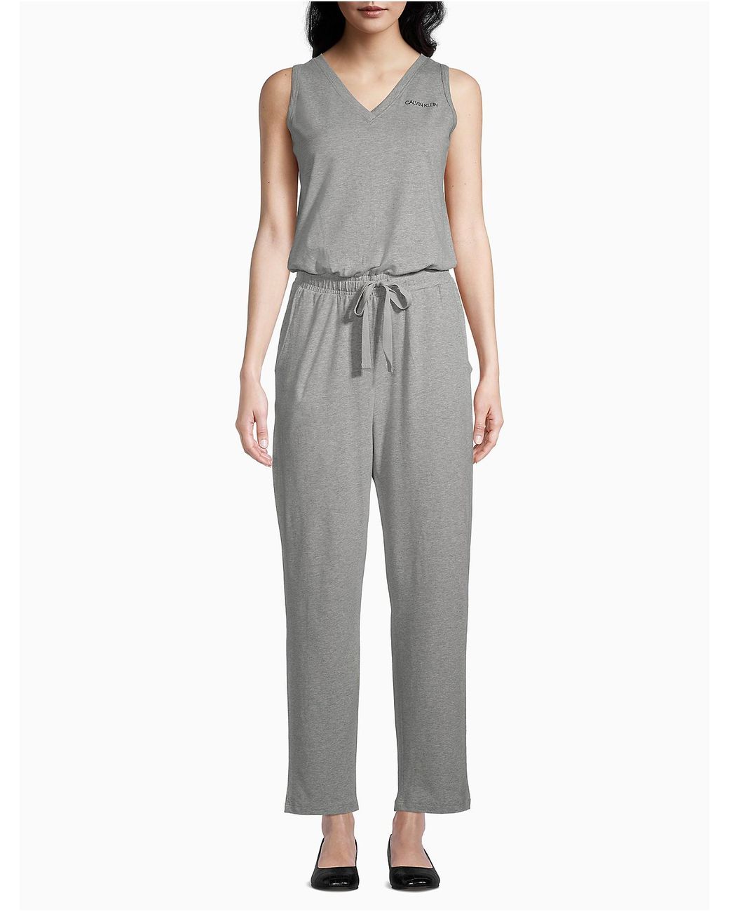 Calvin Klein Synthetic Solid V-neck Logo Jumpsuit in Gray - Save 46% - Lyst