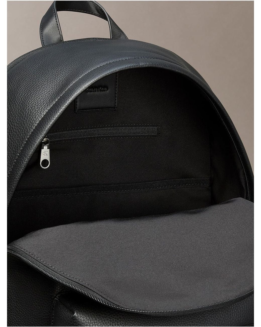 Calvin Klein Gray Pebble Round Backpack for men