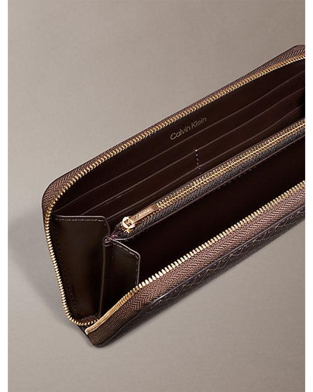 Calvin Klein Brown Allover Emblem Logo Zip Wallet