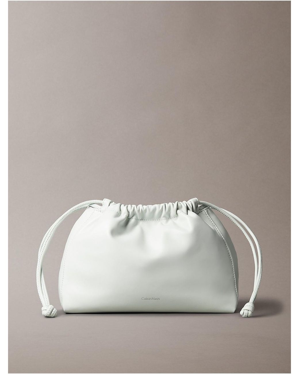 Calvin Klein Drawstring Crossbody Bag in Metallic | Lyst