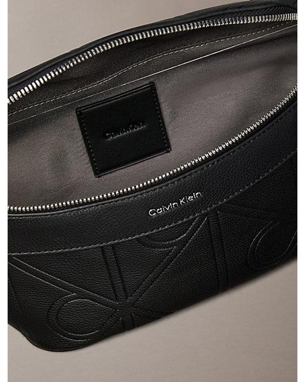 Calvin Klein Black Embossed Emblem Logo Bum Bag for men