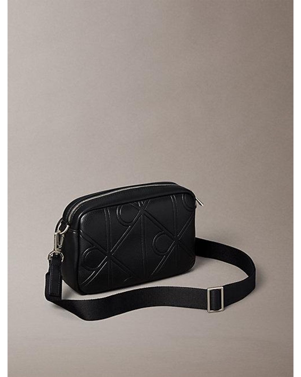 Calvin Klein Black Embossed Emblem Crossbody Camera Bag for men