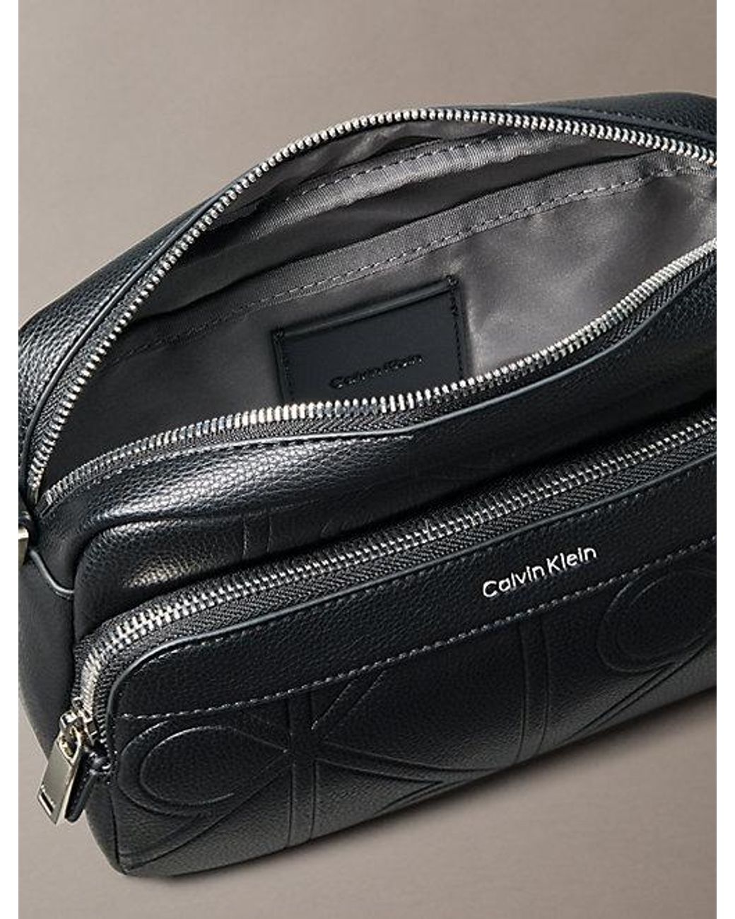 Calvin Klein Black Embossed Emblem Crossbody Camera Bag for men
