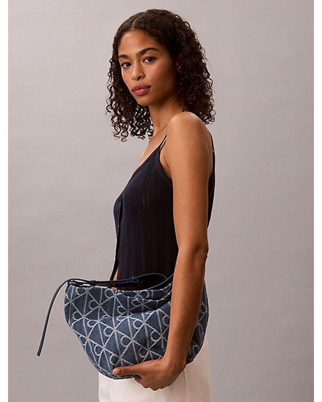Calvin Klein Blue Denim Allover Emblem Logo Bucket Bag