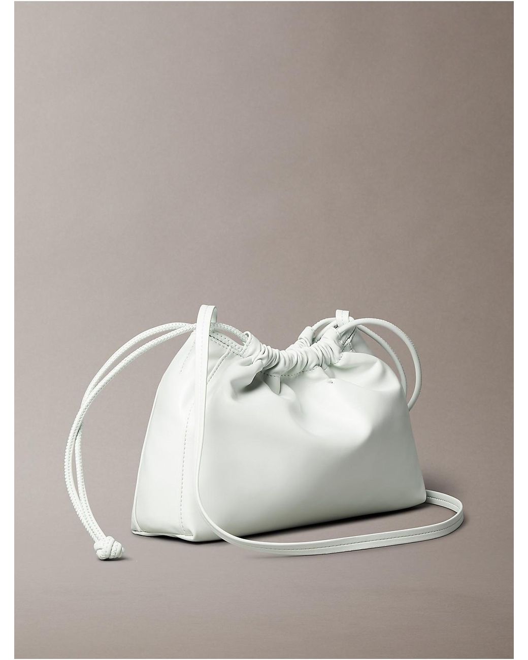 Calvin Klein Drawstring Crossbody Bag in Metallic | Lyst