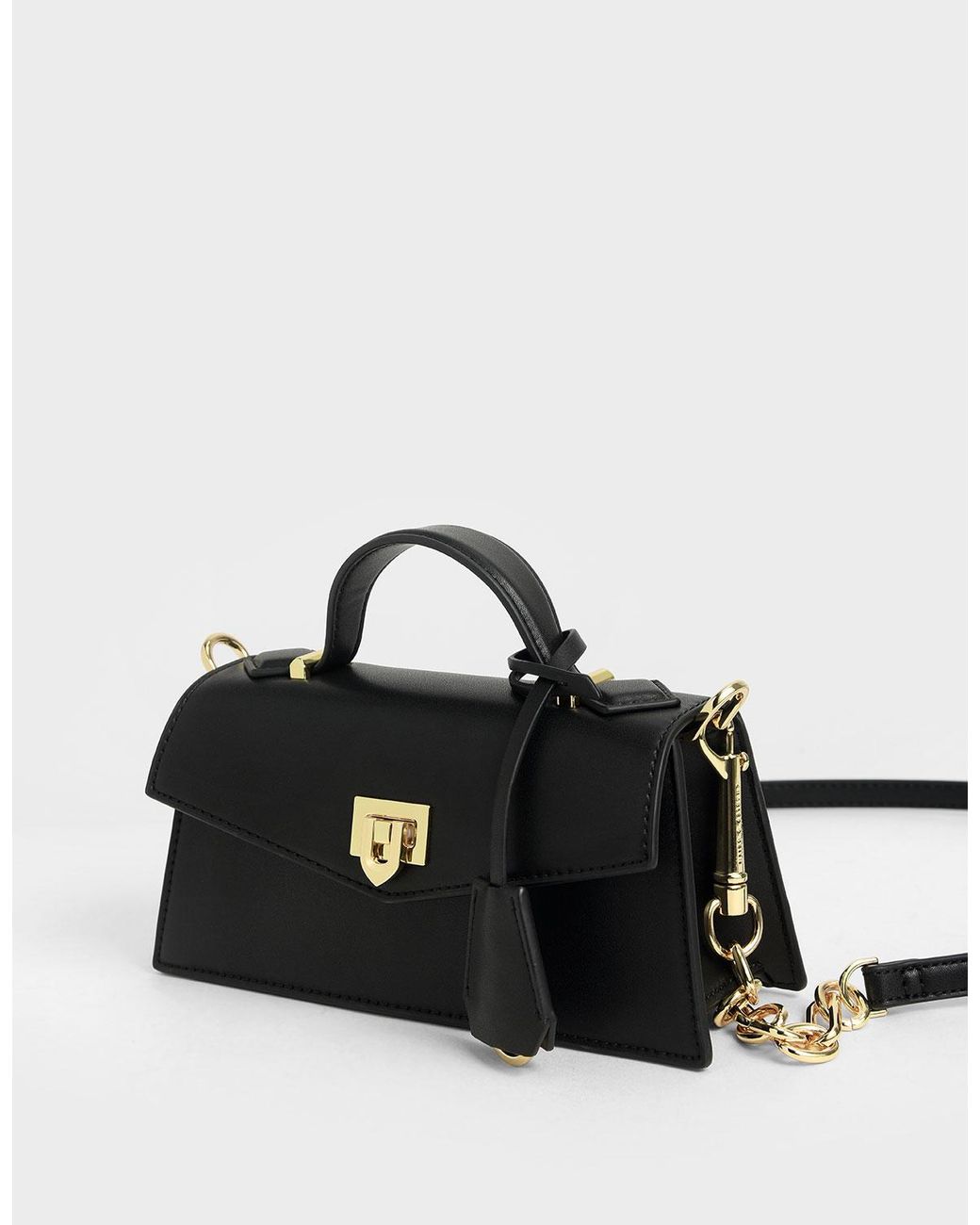 top handle trapeze bag