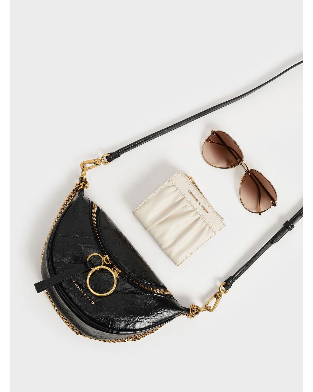 Charles & Keith TEXTURED HALF MOON CROSSBODY BAG ($59) ❤ liked on