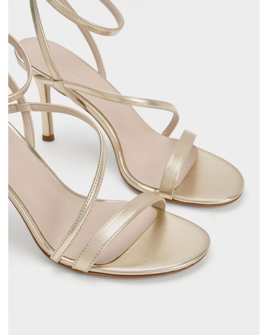 Asymmetrical strappy heels sale