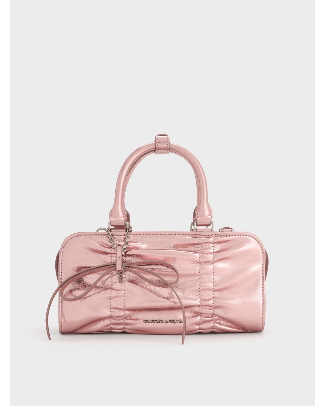 Charles & Keith Pink Kadee Metallic Ruched Bow-Charm Bowling Bag