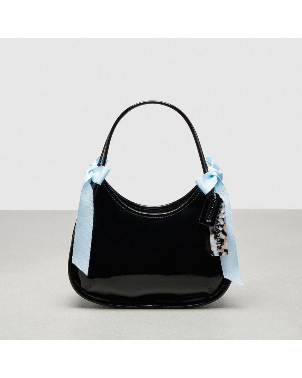 COACH Ergo Bag In Crinkle Patent Topia Leather With Bows in