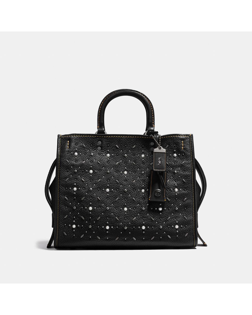 Coach rogue 25 deals with quilting and rivets