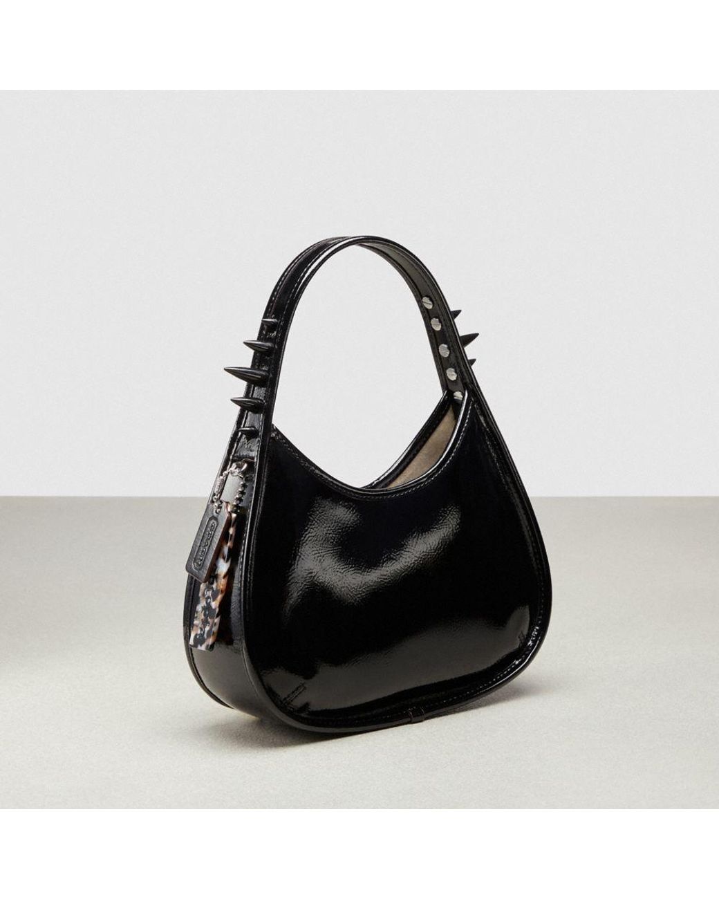 COACH Ergo Bag In Crinkle Patent Topia Leather Spikes in Black | Lyst