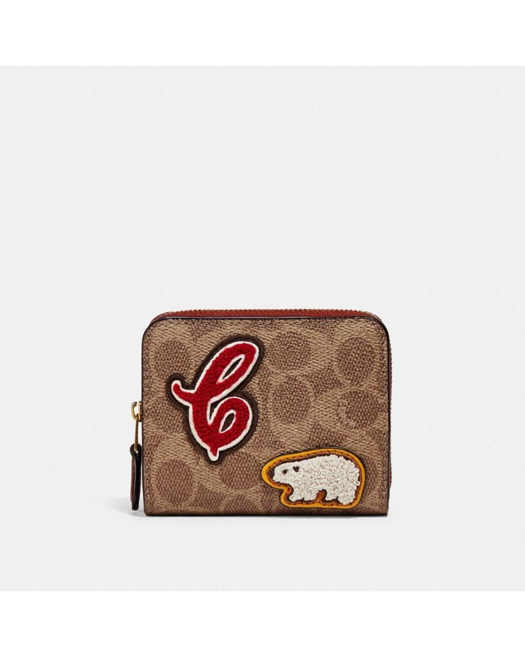 Portefeuille à deux volets en toile exclusive avec pièces écusson Coach  Outlet en coloris Marron | Lyst